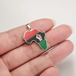 Detail of Africa map pendant with Pan-African colors and fist symbol on silver base