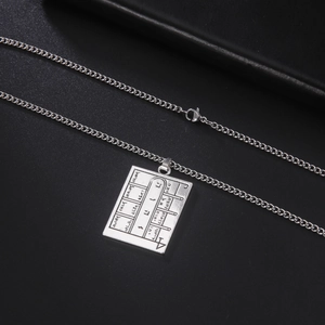 Detailed view of silver Solomon seal amulet pendant with Hebrew symbols and lobster clasp