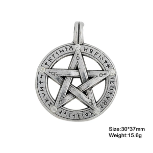 Macro detail of vintage Solomon pentagram pendant with Norse runes and rhinestones