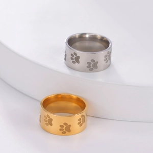 Minimalist 10mm wide titanium steel rings in gold and silver with carved cat paw prints