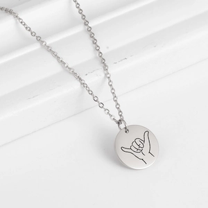 Minimalist stainless steel necklace with engraved Shaka hand sign round pendant