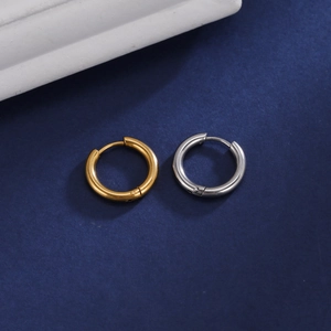 Minimalist 18K gold and silver polished stainless steel hoop earrings on blue background