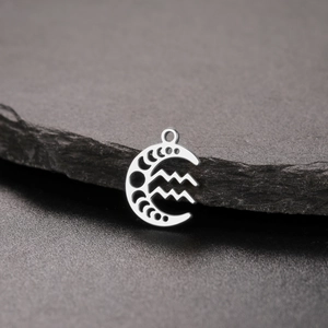 Detailed view of silver stainless steel moon phase and Aquarius zodiac pendant for DIY jewelry