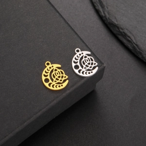 Detailed macro view of 18K gold and silver moon-rose hollow pendants for DIY jewelry making