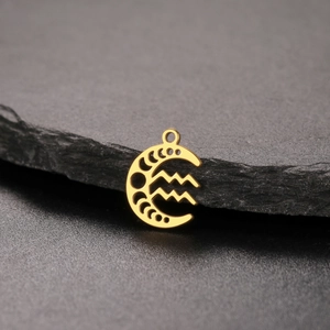 Macro shot of 18K gold plated stainless steel crescent moon pendant with Aquarius sign