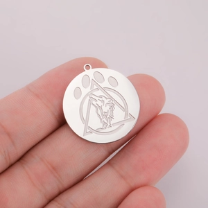 Polished stainless steel wolf head pendant with geometric triangle and claw engraving