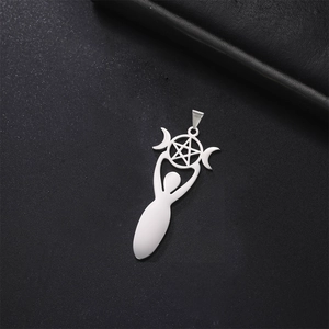 Macro view of polished silver crescent moon and pentagram goddess pendant on black texture