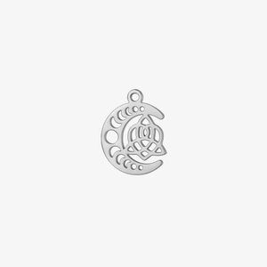 Macro detail of silver moon crescent pendant with Celtic knot and hollowed-out design