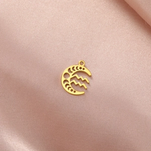 Detail of 18K gold-plated stainless steel crescent moon pendant with wave pattern