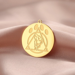 Golden stainless steel wolf head pendant with geometric patterns on pink silk background