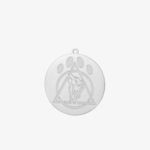 Macro detail of silver stainless steel wolf pendant with embossed Therian symbol