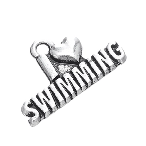 Detail of antique silver swimming heart charm pendant with I Love Swimming engraved text