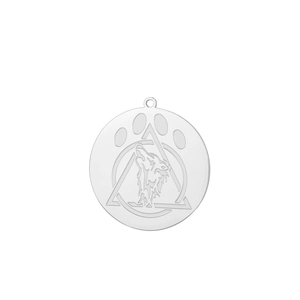 Macro detail of stainless steel wolf and paw print engraved round pendant charm