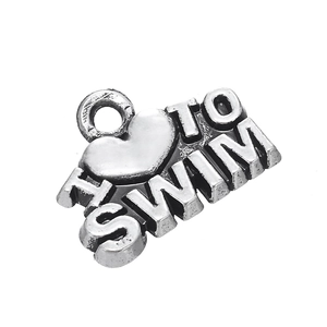 Macro detail of antique silver heart swim charm with engraved I love to swim letters