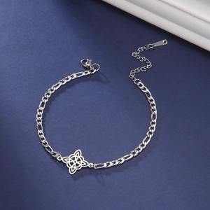 Double-layered stainless steel anklet featuring a Celtic witch knot pendant and Figaro chain