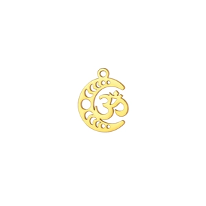 Macro detail of gold-plated crescent moon pendant with hollowed-out Om symbol