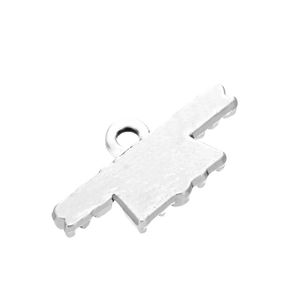 Macro view of flat silver alloy rectangle pendant with a textured serrated bottom edge