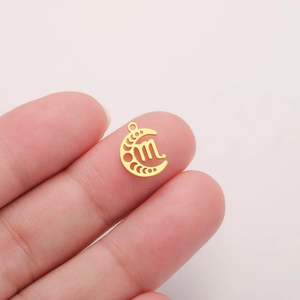 Close-up of 18K gold-plated stainless steel crescent moon pendant with Scorpio zodiac sign