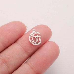Detailed close-up of a crescent moon stainless steel pendant with Pi symbol engraving