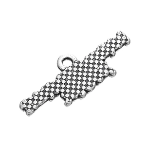 Detailed view of antique silver sports pendant featuring textured relief for DIY jewelry
