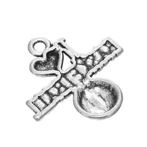 Detailed close-up of antique silver alloy pendant with I Heart Lift design for DIY jewelry