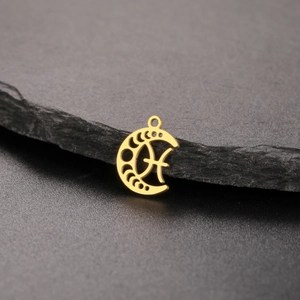 Macro detail of an 18K gold plated stainless steel crescent moon phase pendant