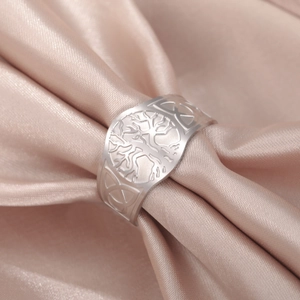 Titanium steel Tree of Life open ring featuring Celtic knots on a champagne silk fabric