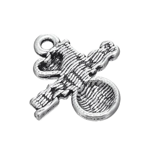 Detail of silver alloy sports charm with industrial horizontal stripes and top ring