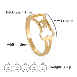 Gold stainless steel dog bone and paw print cut-out ring shown in a 45-degree angle