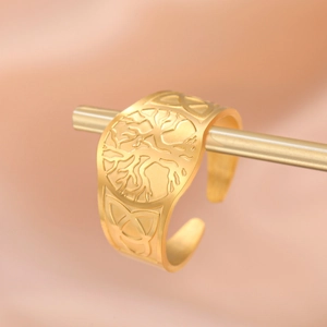 Gold plated stainless steel open ring featuring tree of life and celtic knot relief