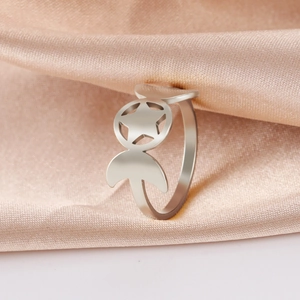 Silver stainless steel crescent moon and pentagram ring on elegant champagne silk background
