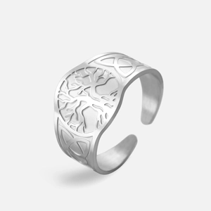 Detail showing vintage Tree of Life engraving and Celtic knot patterns on silver ring