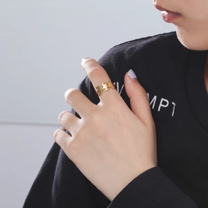 Polished 18K gold plated stainless steel ring featuring crescent moon and star cutouts