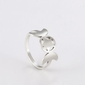 Macro shot of silver triple moon goddess ring featuring central pentagram star on band