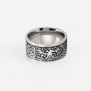 Macro shot of stainless steel Tree of Life ring featuring detailed Celtic knot engraving