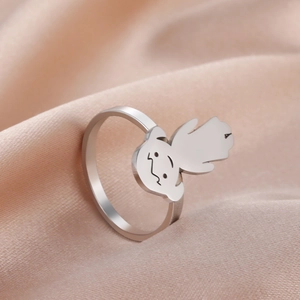 Detailed view of silver stainless steel ring featuring a minimalist cartoon girl design