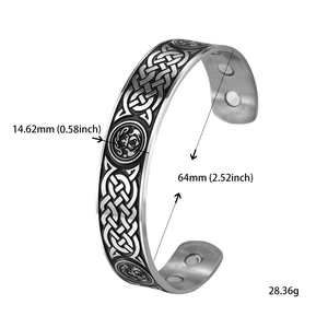 Detail view of Celtic knot engravings and therapeutic magnets on stainless steel cuff