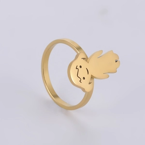 Detailed view of a golden minimalist cartoon girl character ring made of stainless steel