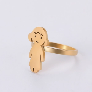 Detailed view of a golden minimalist cartoon girl ring in polished stainless steel finish