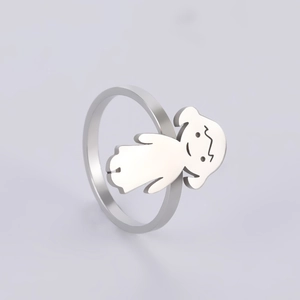 Detailed close-up of a silver-tone stainless steel ring with a cute cartoon girl motif