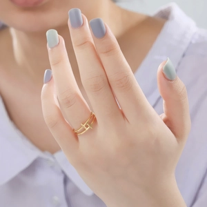 Minimalist double layer gold stainless steel ring with geometric bars on model finger
