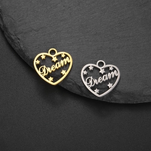 Polished stainless steel heart-shaped Dream charms in gold and silver finish