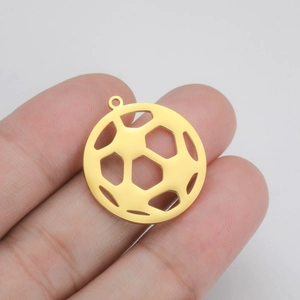 Detailed macro view of a gold football pendant with hollow geometric cutout design