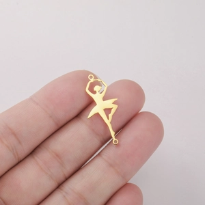 Macro view of tiny 18K gold-plated ballet dancer pendant charm for DIY jewelry making