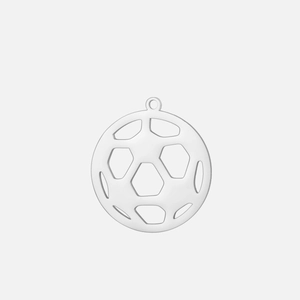 Macro shot of silver stainless steel pendant with hollow football pattern and top ring