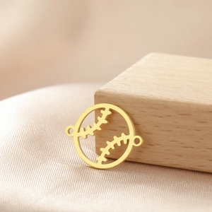 Detailed view of a gold-plated stainless steel hollow baseball charm for DIY jewelry