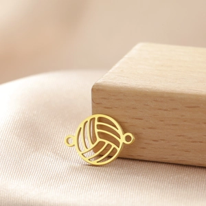 Detail showing a hollow volleyball pendant in gold stainless steel with dual ring connectors