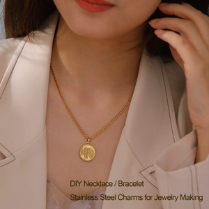 Golden stainless steel coin necklace with elephant engraving on a female model