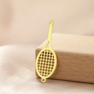 Macro shot of gold-plated stainless steel tennis racket charm with hollow mesh for DIY jewelry