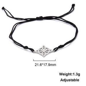 Detail of adjustable black cord bracelet with a silver Celtic knot stainless steel charm